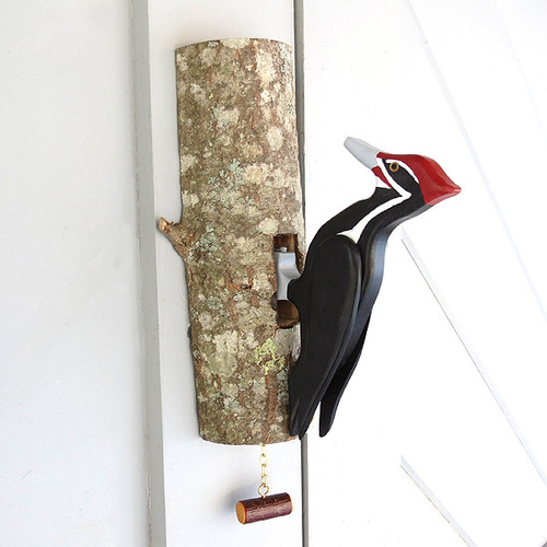 Woodpecker Door Knocker on hardwood log base.